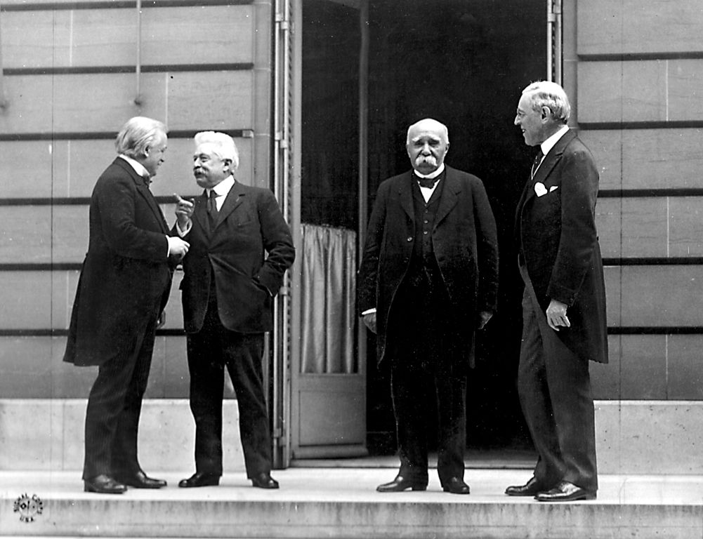 The “Big Four” at the Paris Peace Conference in 1919. From left: British Prime Minister David Lloyd George, Italian Prime Minister Vittorio Emanuele Orlando, French Premier Georges Clemenceau, American President Woodrow Wilson. Source: Wikimedia Commons